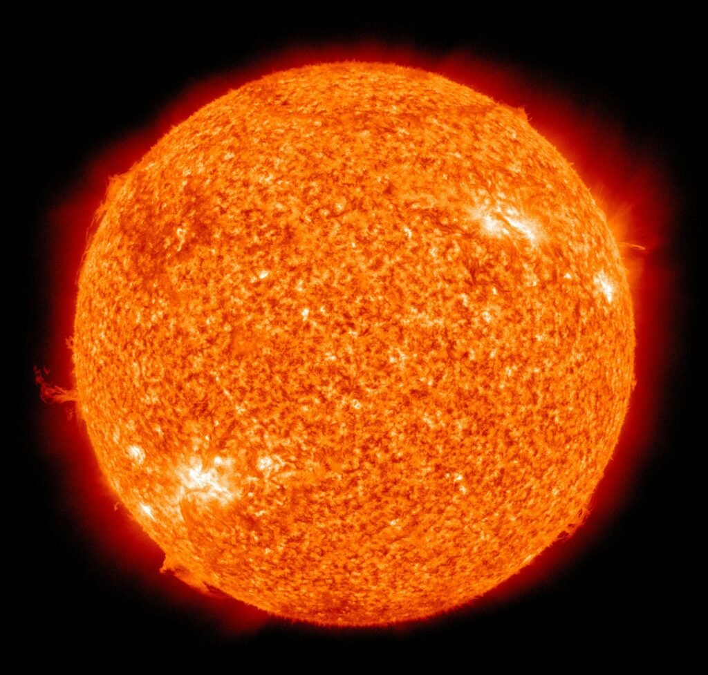 Detailed image of the sun showcasing its fiery surface and glowing edges.